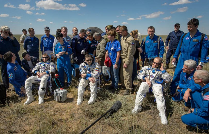 Tim Peake of the European Space Agency, left, Yuri Malenchenko of Roscosmos center, and Tim Kopra of NASA sit in chairs outside the Soyuz TMA-19M spacecraft just minutes after they landed in a remote area near the town of Zhezkazgan, Kazakhstan on Saturday, June 18, 2016. Kopra, Peake, and Malenchenko are returning after six months in space where they served as members of the Expedition 46 and 47 crews onboard the International Space Station. Photo Credit: (NASA/Bill Ingalls)